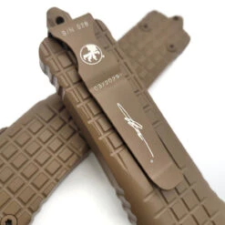Microtech Combat Troodon142-1CT-CTA Delta D/E Frag Cerakote Tan Fluted Cerakote Tan Standard Nickel Boron Internals -Microtech Shop 350947790 1072806640773160 6217687170897853791 n 43217.1686061018