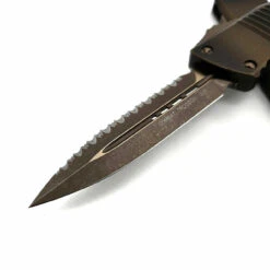 Microtech 142-15APABS Combat Troodon Antique Bronze Handle Double Edge Full Serrated Bronze Apocalyptic Blade & Hardware -Microtech Shop 364225637 700519575242817 5981057003697806897 n 13566.1691123482