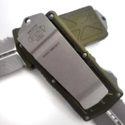 Microtech Exocet 157-12APOD OD Green Apocalyptic Double Edge Full Serrated OTF Money Clip -Microtech Shop DC7A5828 853A 47E6 9AB6 825D5B86B49E 97698.1667056617